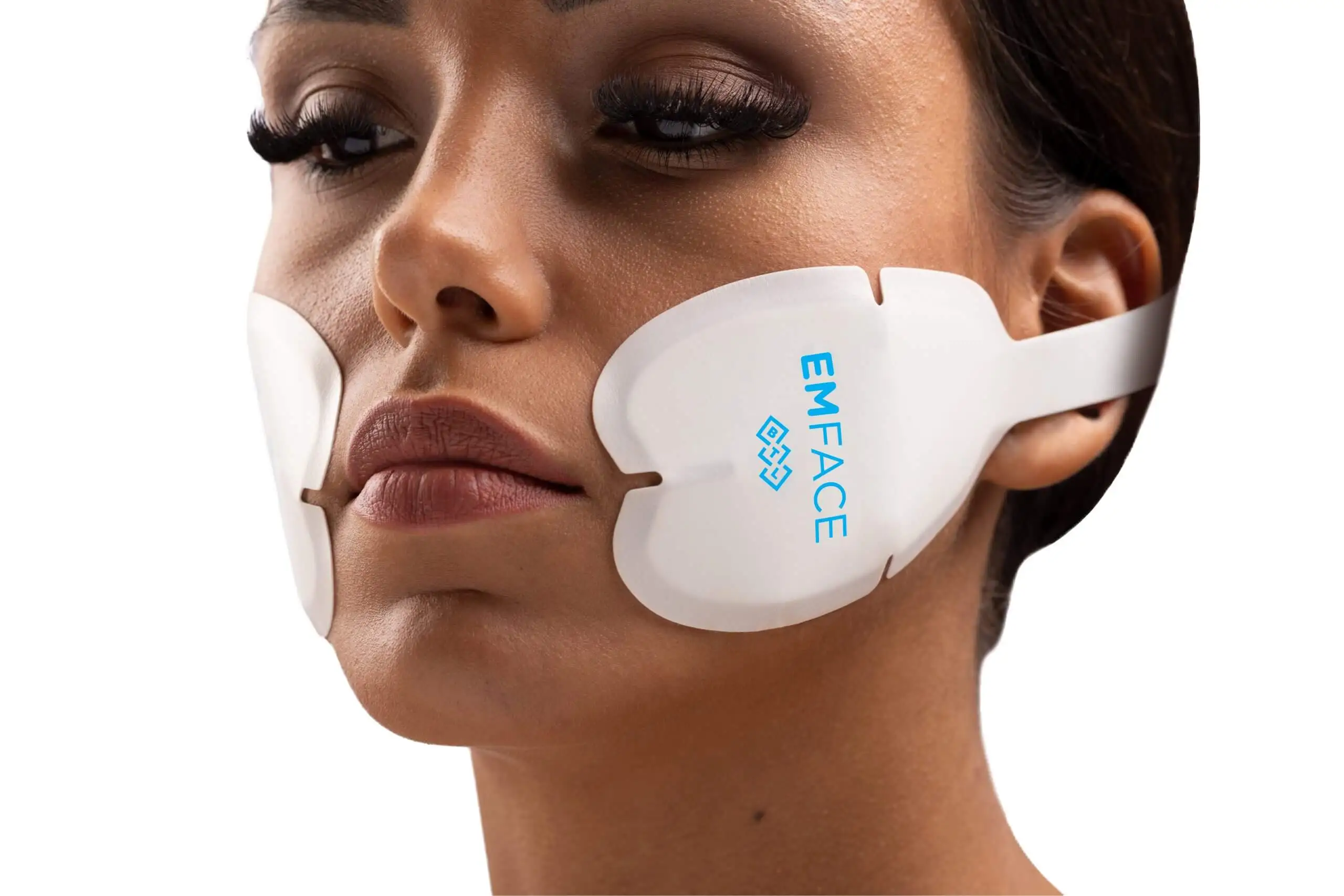 Woman receiving a treatment for Emface to tighten face