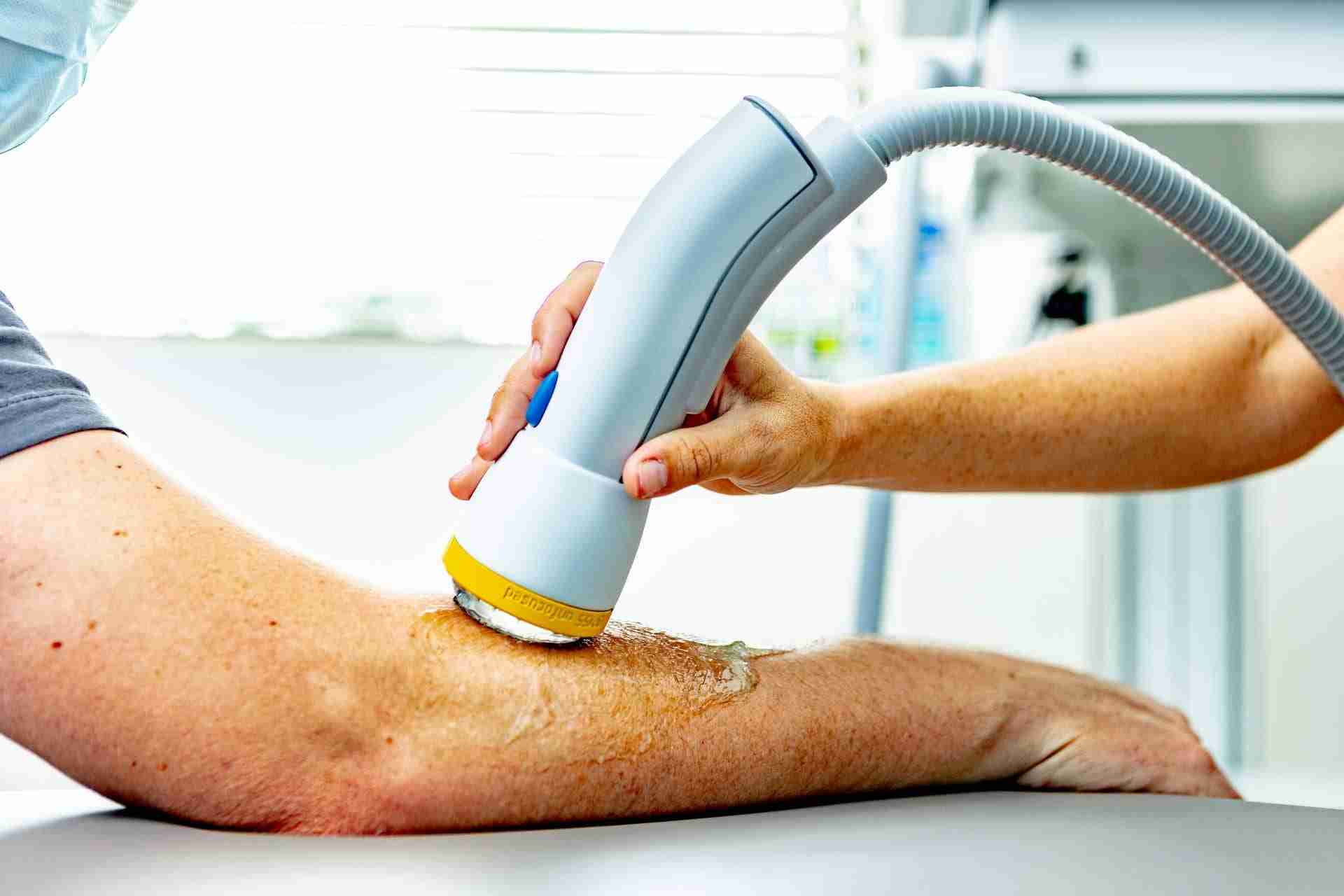 Man receiving a therapy on his arm